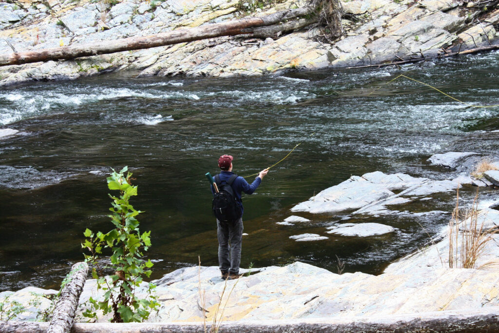 Man fishing in Oklahoma on the Mountain Fork River.